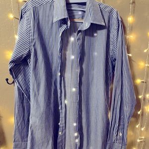 Button down dress shirt. Not sure of brand, the tag says “Shirt”.